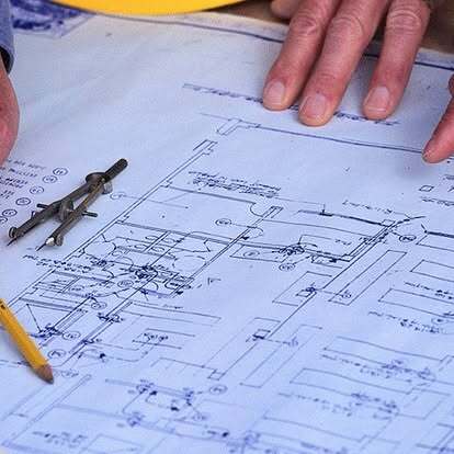 Keith reviewing construction plans
