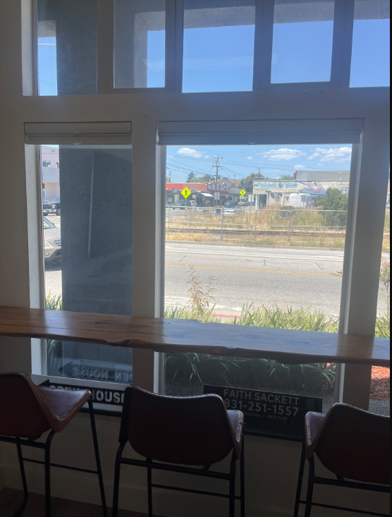 Epique Texas office — live-edge window bar with seating